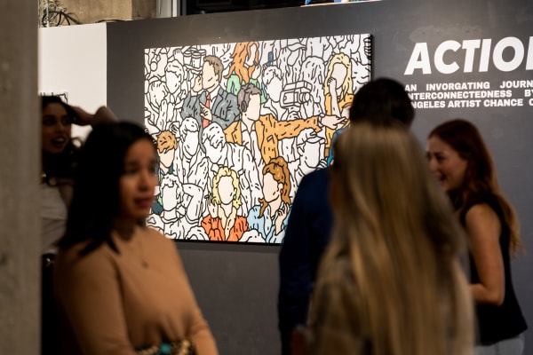 People at a Chicago art event, a solo exhibition for artist Chance Cooper titled "Action!", hosted by Chicago art gallery Carousel Fine Art.