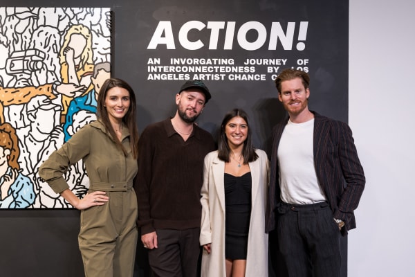 People at a Chicago art event, a solo exhibition for artist Chance Cooper titled "Action!", hosted by Chicago art gallery Carousel Fine Art.
