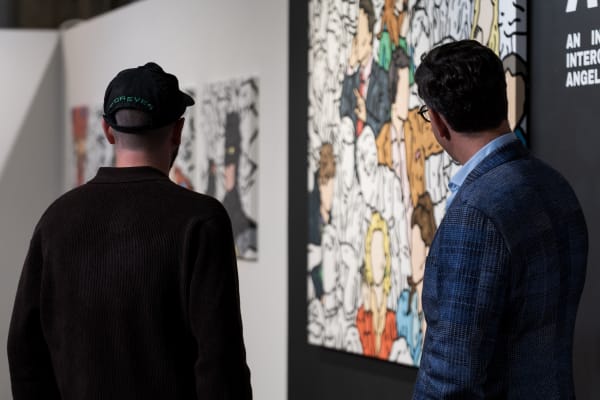 People at a Chicago art event, a solo exhibition for artist Chance Cooper titled "Action!", hosted by Chicago art gallery Carousel Fine Art.