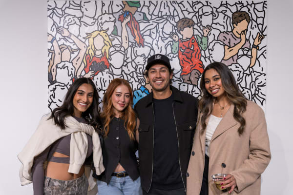 People at a Chicago art event, a solo exhibition for artist Chance Cooper titled "Action!", hosted by Chicago art gallery Carousel Fine Art.