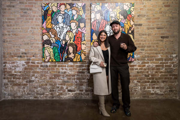 People at a Chicago art event, a solo exhibition for artist Chance Cooper titled "Action!", hosted by Chicago art gallery Carousel Fine Art.