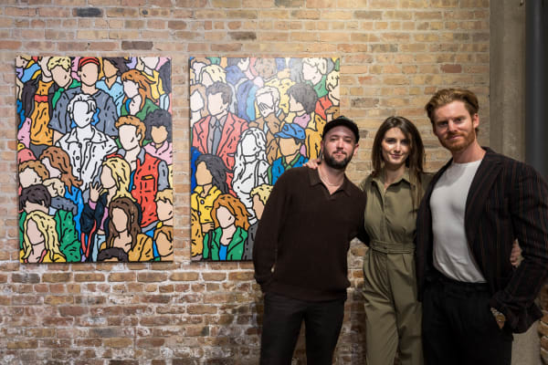 People at a Chicago art event, a solo exhibition for artist Chance Cooper titled "Action!", hosted by Chicago art gallery Carousel Fine Art.