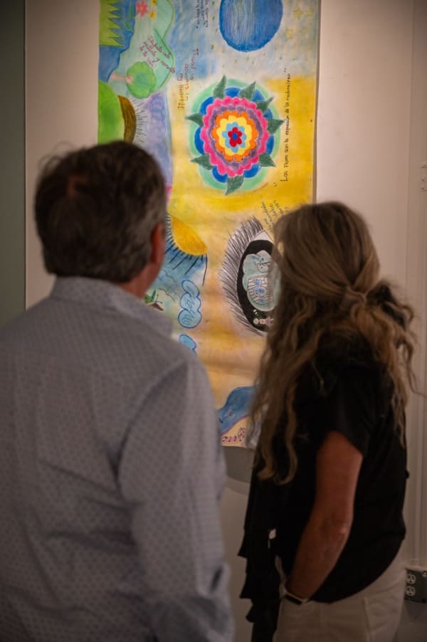 People at Carousel Fine Art's Miami gallery space for the exhibition, "If These Walls Could Talk."