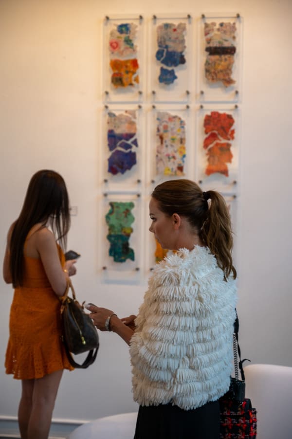 People at Carousel Fine Art's Miami gallery space for the exhibition, "If These Walls Could Talk."