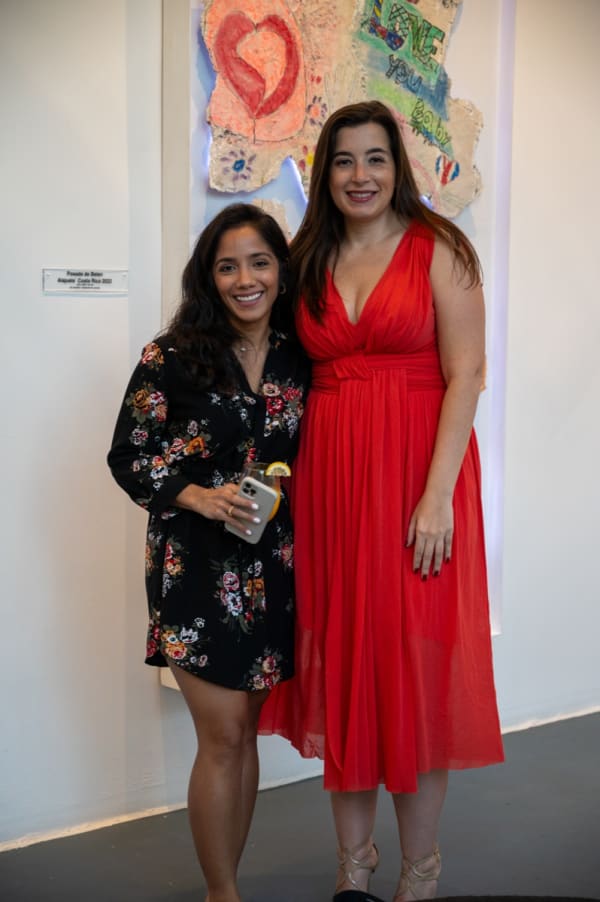 Women posing for photo at Carousel Fine Art's Miami gallery space for the exhibition, "If These Walls Could Talk."
