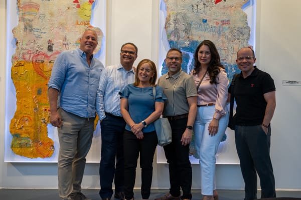People at Carousel Fine Art's Miami gallery space for the exhibition, "If These Walls Could Talk."