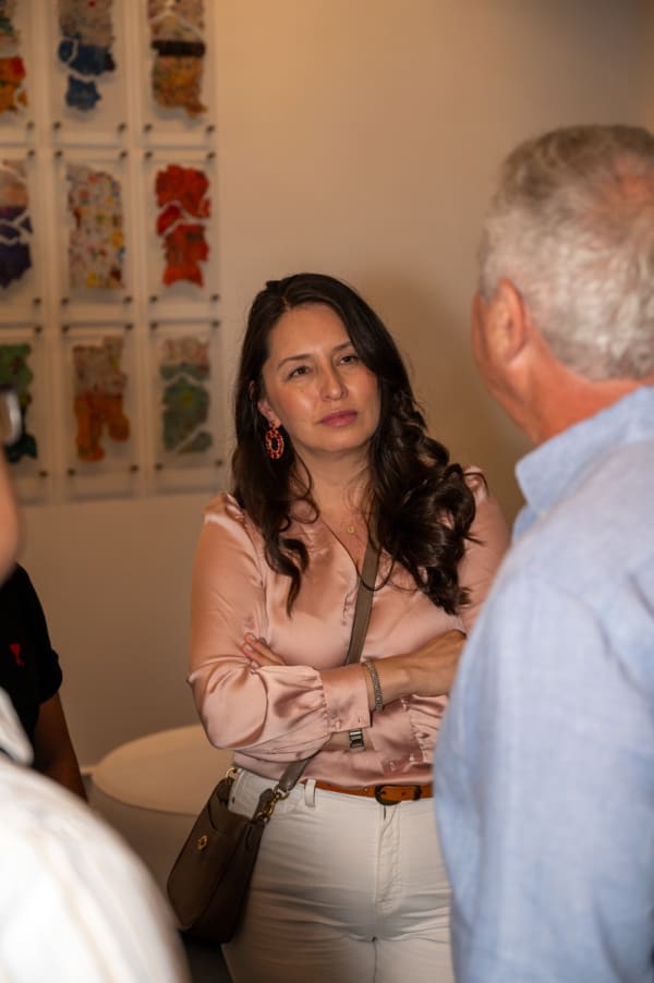 People at Carousel Fine Art's Miami gallery space for the exhibition, "If These Walls Could Talk."