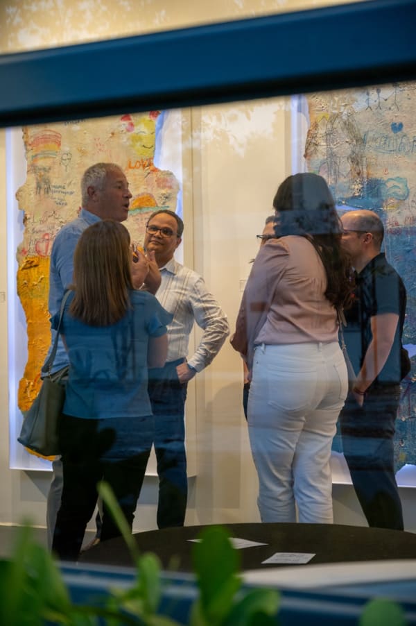 People at Carousel Fine Art's Miami gallery space for the exhibition, "If These Walls Could Talk."