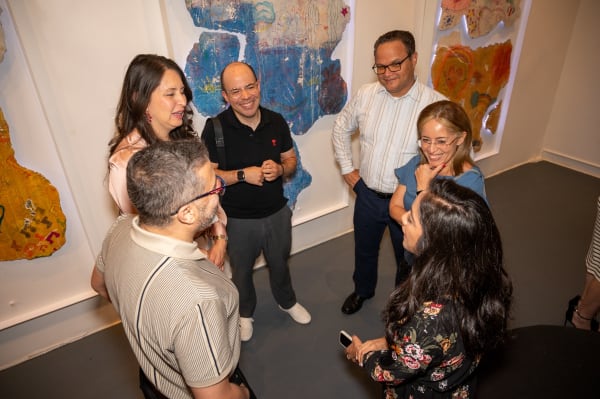 People at Carousel Fine Art's Miami gallery space for the exhibition, "If These Walls Could Talk."