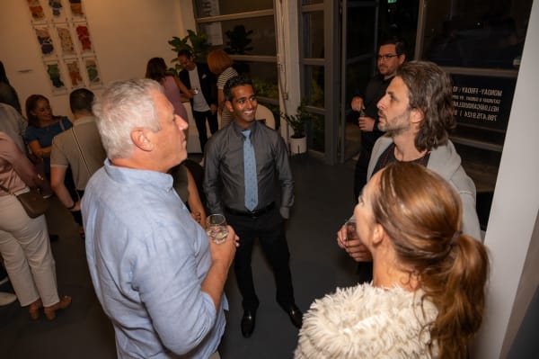 People at Carousel Fine Art's Miami gallery space for the exhibition, "If These Walls Could Talk."