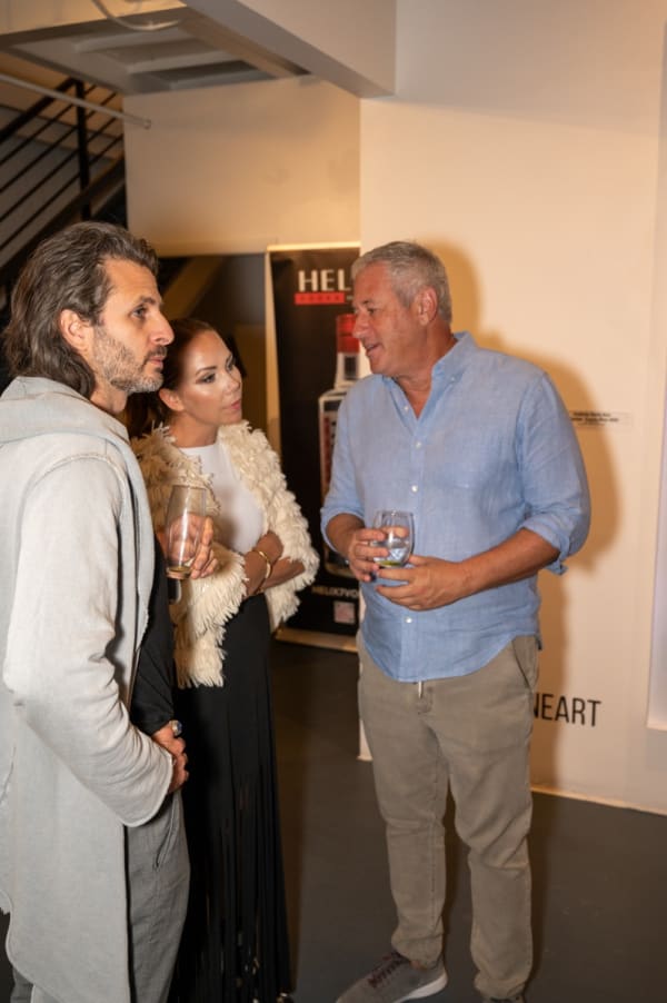 People at Carousel Fine Art's Miami gallery space for the exhibition, "If These Walls Could Talk."