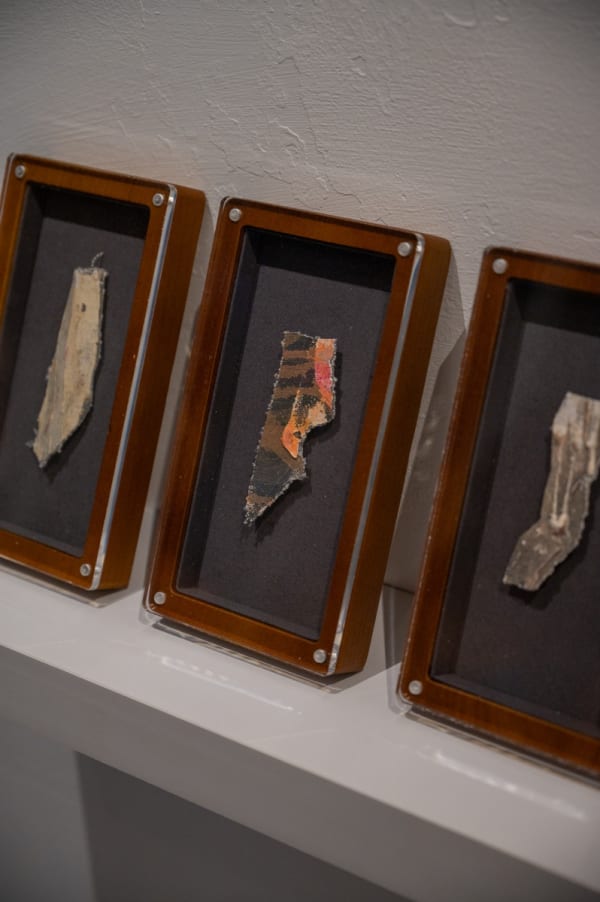 Paintings displayed at Carousel Fine Art's Miami gallery space for the exhibition, "If These Walls Could Talk."