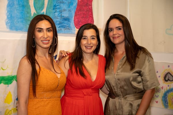 People at Carousel Fine Art's Miami gallery space for the exhibition, "If These Walls Could Talk."