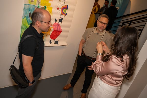 People at Carousel Fine Art's Miami gallery space for the exhibition, "If These Walls Could Talk."