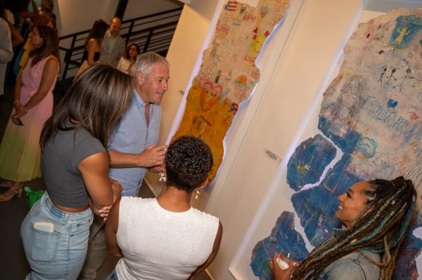 People at Carousel Fine Art's Miami gallery space for the exhibition, "If These Walls Could Talk."