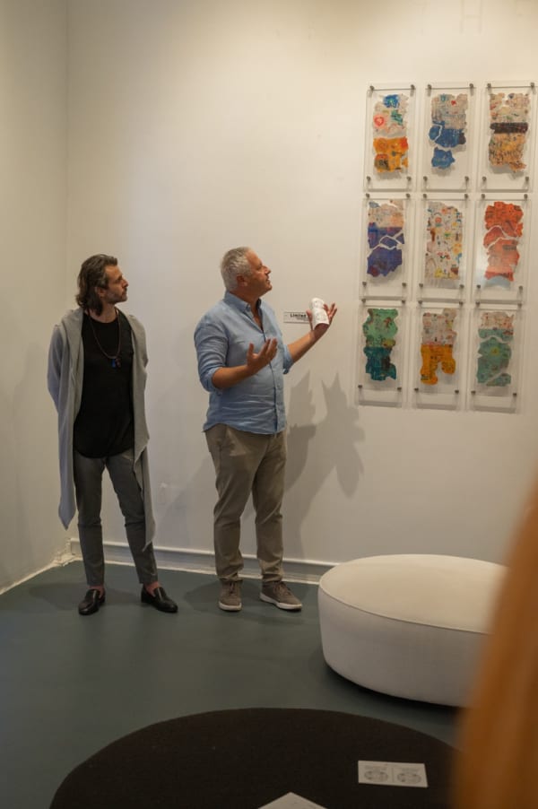 People at Carousel Fine Art's Miami gallery space for the exhibition, "If These Walls Could Talk."