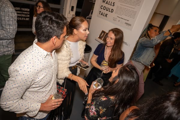 People at Carousel Fine Art's Miami gallery space for the exhibition, "If These Walls Could Talk."