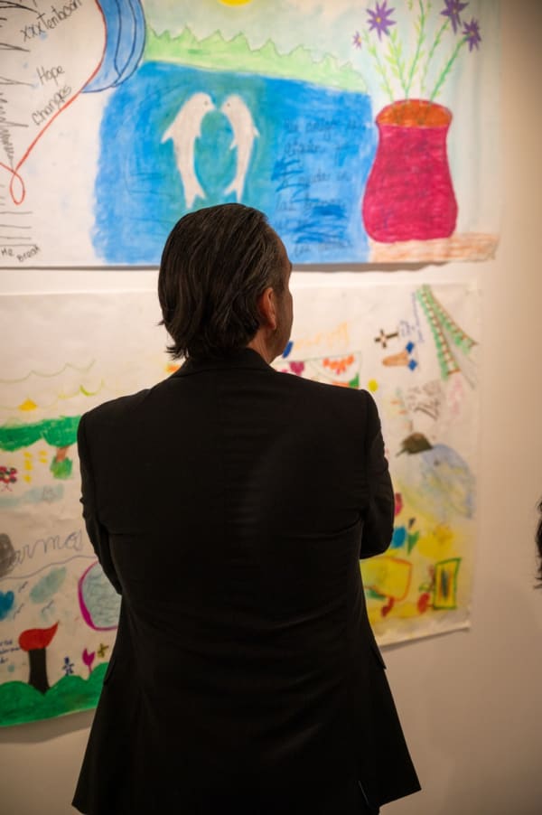 Man from behind at Carousel Fine Art's Miami gallery space for the exhibition, "If These Walls Could Talk."