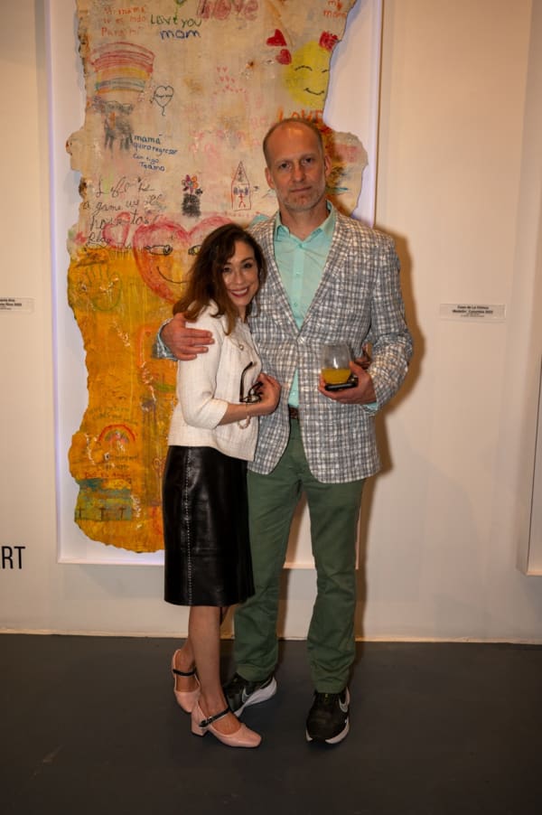 People posing for photo at Carousel Fine Art's Miami gallery space for the exhibition, "If These Walls Could Talk."