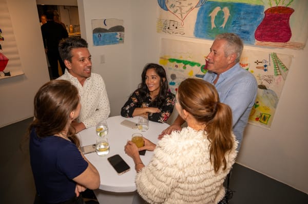 People at Carousel Fine Art's Miami gallery space for the exhibition, "If These Walls Could Talk."