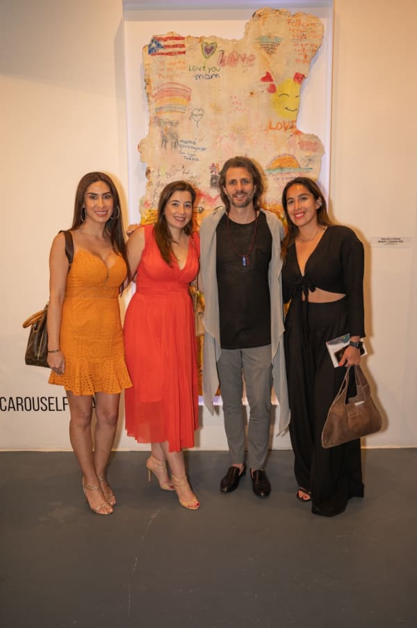 People at Carousel Fine Art's Miami gallery space for the exhibition, "If These Walls Could Talk."
