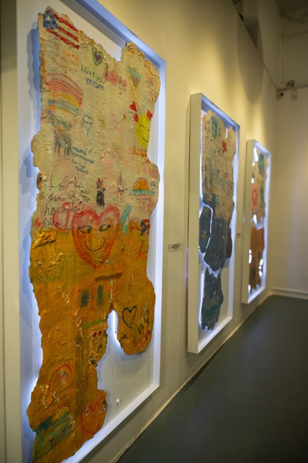Paintings displayed at Carousel Fine Art's Miami gallery space for the exhibition, "If These Walls Could Talk."