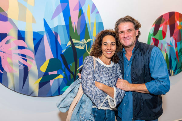 People inside Carousel Fine Art's Miami gallery space during Neill Wright's exhibition "Where the Light Gets In."