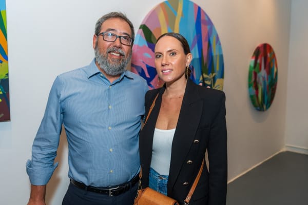 People inside Carousel Fine Art's Miami gallery space during Neill Wright's exhibition "Where the Light Gets In."