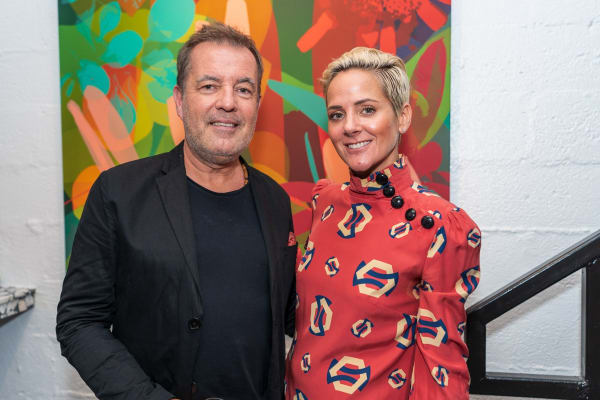 People inside Carousel Fine Art's Miami gallery space during Neill Wright's exhibition "Where the Light Gets In."