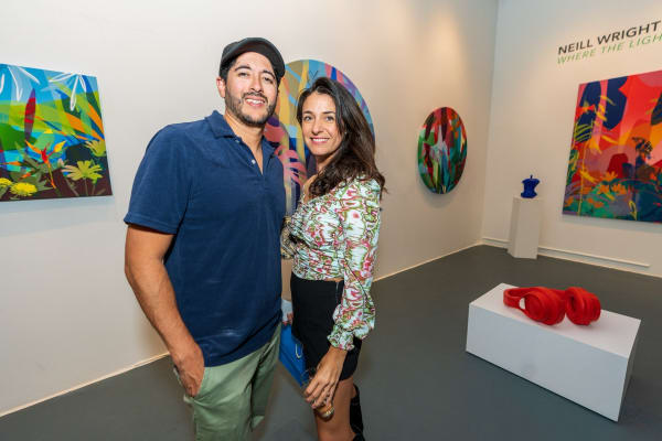 People inside Carousel Fine Art's Miami gallery space during Neill Wright's exhibition "Where the Light Gets In."