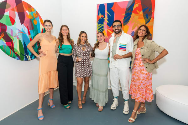 People inside Carousel Fine Art's Miami gallery space during Neill Wright's exhibition "Where the Light Gets In."