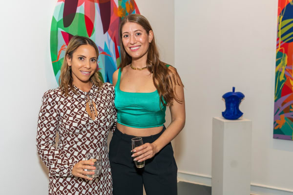 People inside Carousel Fine Art's Miami gallery space during Neill Wright's exhibition "Where the Light Gets In."