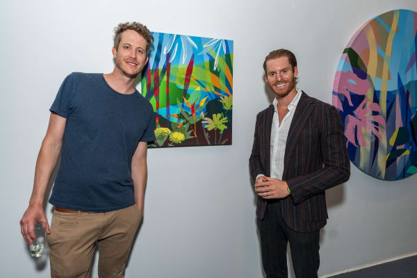 People inside Carousel Fine Art's Miami gallery space during Neill Wright's exhibition "Where the Light Gets In."