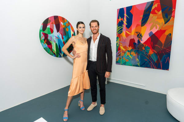 Gallery owners of Carousel Fine Art inside Carousel Fine Art's Miami gallery space during Neill Wright's exhibition "Where the Light Gets In."