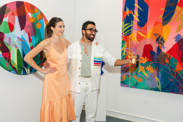 People inside Carousel Fine Art's Miami gallery space during Neill Wright's exhibition "Where the Light Gets In."