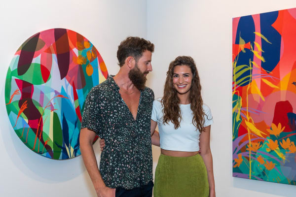 People inside Carousel Fine Art's Miami gallery space during Neill Wright's exhibition "Where the Light Gets In."