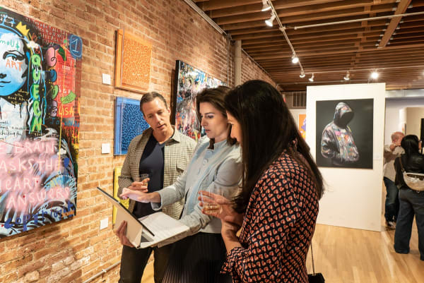 People in Carousel Fine Art's Chicago location during the Chicago Grand Opening.