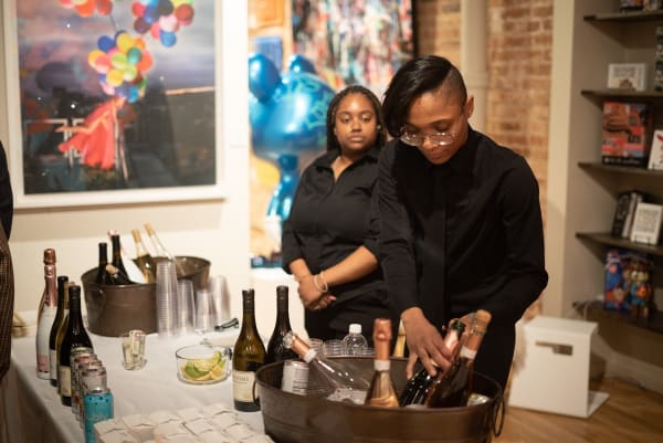Bartenders at make-shift bar at Carousel Fine Art's Chicago location during the Chicago Grand Opening.