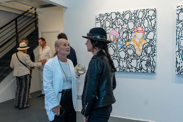People at Carousel Fine Art's gallery space in Miami, FL during Chance Cooper's Spotlight Exhibition, "Between Me and You."