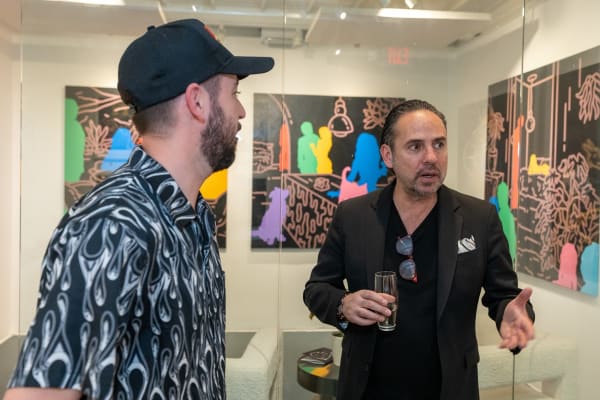 People at Carousel Fine Art's gallery space in Miami, FL during Chance Cooper's Spotlight Exhibition, "Between Me and You."