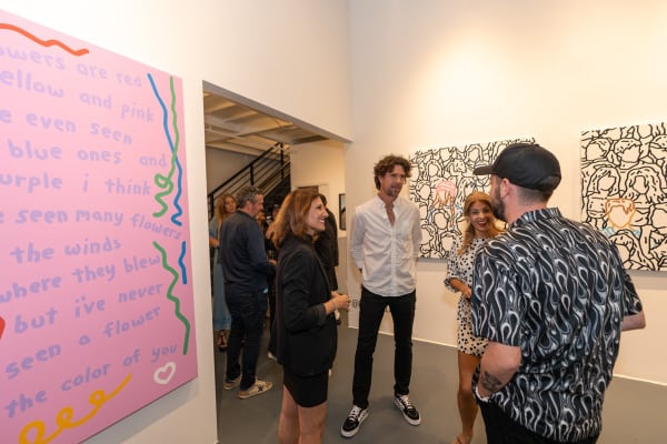 People at Carousel Fine Art's gallery space in Miami, FL during Chance Cooper's Spotlight Exhibition, "Between Me and You."