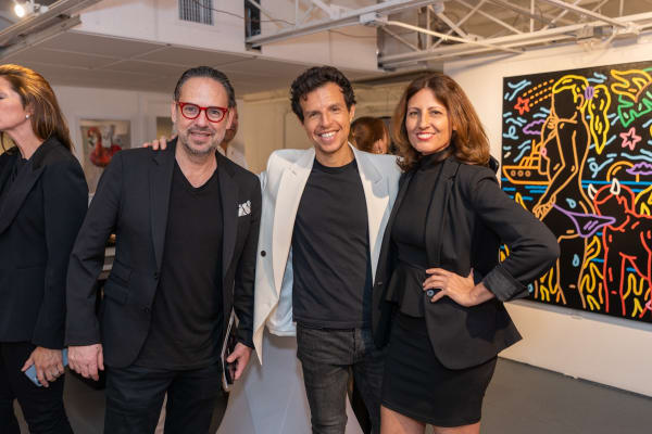 People at Carousel Fine Art's gallery space in Miami, FL during Chance Cooper's Spotlight Exhibition, "Between Me and You."