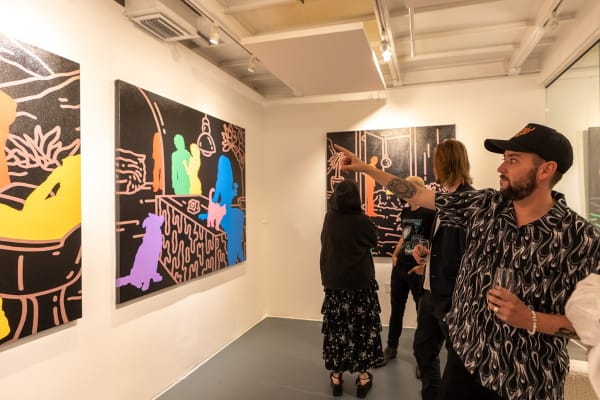 People at Carousel Fine Art's gallery space in Miami, FL during Chance Cooper's Spotlight Exhibition, "Between Me and You."