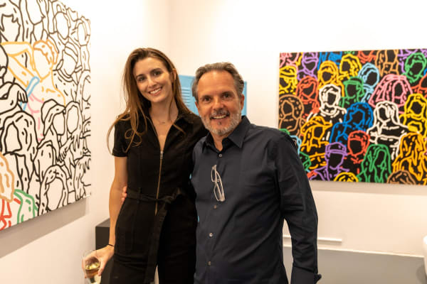 People at Carousel Fine Art's gallery space in Miami, FL during Chance Cooper's Spotlight Exhibition, "Between Me and You."