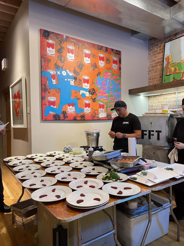 Table with food for Collector's Dinner at Carousel Fine Art's gallery space in Chicago.