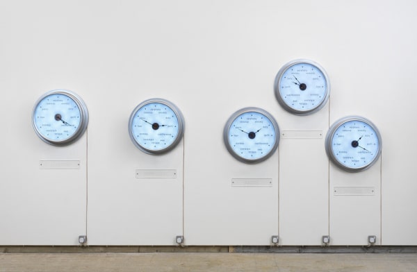 Raqs Media Collective, Escapement, 2009. Twenty-seven clocks, high gloss aluminium with LED lights, four flat-screen monitors, video and audio (looped), dimensions variable. Image courtesy of Raqs Media Collective and Frith Street Gallery, London.