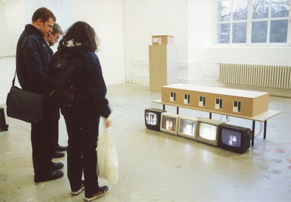 Dormitory 기숙사 (2000) 200x80x80cm A dormitory model made of wood, 5 video cameras, 5 monitors, 5 motors