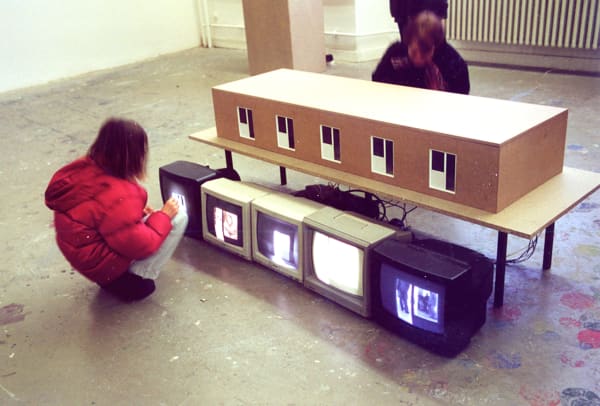 Dormitory 기숙사 (2000) 200x80x80cm A dormitory model made of wood, 5 video cameras, 5 monitors, 5 motors