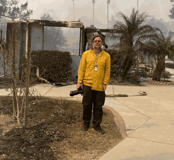Kevin Cooley in front of his Altadena home destroyed by the Eaton Fire. (Aaron Giesel/ Courtesy Kevin Cooley)