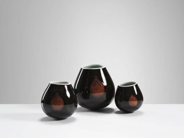 Chris Keenan, 97-99 Trio of tenmoku and celadon rocking bowls with red teardrop